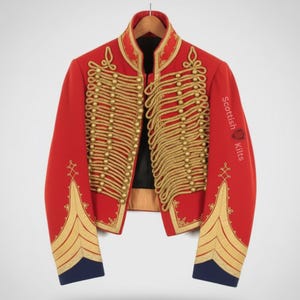 May include: A red military jacket with gold-colored embellishments and the text "Scottish Kilts" on the sleeve. The jacket features intricate gold rope detailing, gold buttons, and gold trim on the cuffs and collar. The cuffs are navy blue.