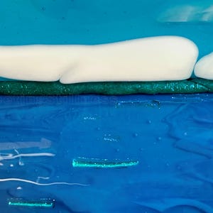 May include: A layered abstract artwork featuring a bright blue sky, a horizontal band of white clouds, a dark green textured strip, and a deep blue water surface with subtle light blue ripples and the text 248 and Fleetingstillness.