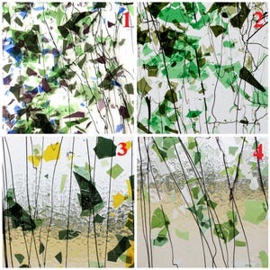 May include: A collage of four glass panels featuring scattered shards of green, blue, yellow, and purple glass embedded in clear glass with thin, dark, vertical stringer lines. Each panel is numbered one through four in red text.