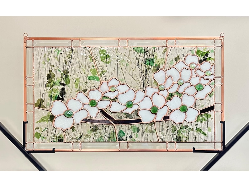 May include: A rectangular stained glass panel featuring white dogwood flowers with green glass centers and dark brown branches. The design is framed in copper metal with a clear textured glass background containing green leaf-like glass shards.