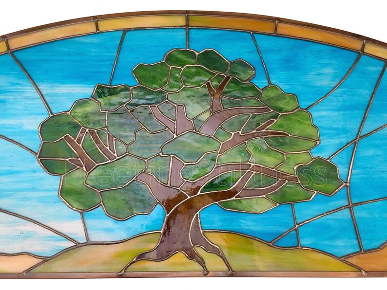 May include: A stained glass window depicting a stylized tree with brown branches and green leaves against a blue sky background.