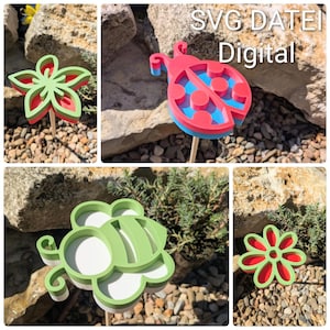 May include: A selection of vibrant garden stakes featuring a flower, a ladybug, and a bee design. The stakes are constructed from layered materials in red, green, blue, and white. The image includes the text "SVG DATEI Digital".