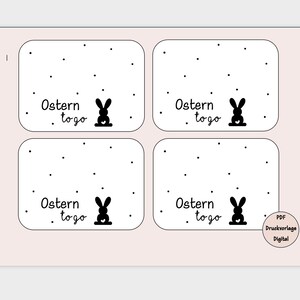 Könnte beinhalten: Vier druckbare Geschenkanhänger mit einer schwarzen Hasensilhouette und dem Text "Ostern to go" auf weißem Hintergrund mit schwarzen Punkten.
