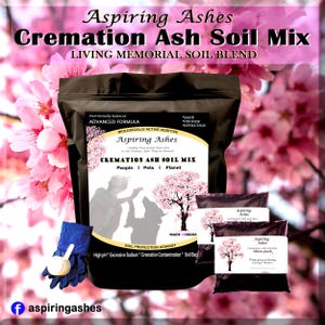 May include: A product image featuring Aspiring Ashes Cremation Ash Soil Mix. The main package is black with white text and a graphic of a tree. Smaller share packs are also visible. The background includes pink cherry blossoms and a blue glove with a scoop.