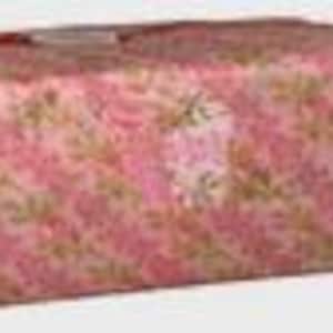 May include: A rectangular gift box wrapped in pink floral patterned paper. The paper has a repeating pattern of pink flowers and green leaves on a pink background. A small white tag is attached to the top of the box.
