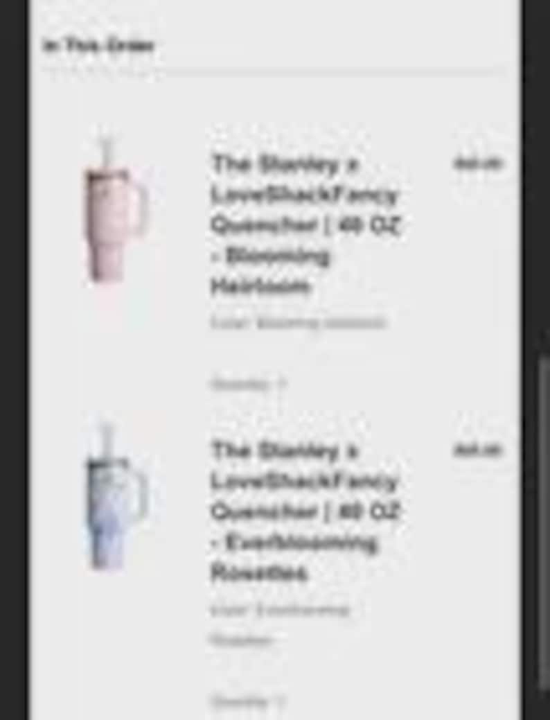 May include: Two Stanley x LoveShackFancy Quencher tumblers, 40 oz each, in Blooming Heirloom and Everblooming Rosettes colors. Each tumbler has a handle and a straw. The text "The Stanley x LoveShackFancy Quencher | 40 OZ" is visible.