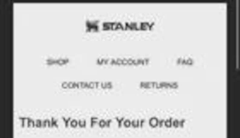 May include: A black and white image of a mobile phone screen displaying the Stanley logo at the top. Below the logo are the words "SHOP", "MY ACCOUNT", "FAQ", "CONTACT US", and "RETURNS". The text "Thank You For Your Order" is at the bottom.