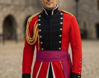 May include: A red military-style jacket featuring a black front panel with silver buttons, gold braided shoulder cords, and a purple sash tied at the waist. The jacket has black cuffs and white panels visible at the bottom hem of the garment.