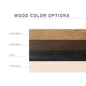 May include: Image displaying wood color options: Classic Brown, Saddle Brown, Ebony, and Finished Pine. The text "WOOD COLOR OPTIONS" is at the top. Each color sample is a horizontal rectangle, showcasing the grain and hue of the wood.