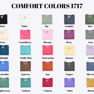 a collection of 17 different colored t-shirts, each with a unique color and design, arranged in a grid format.