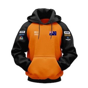 Puede incluir: Sudadera con capucha naranja y negra con varios logotipos de empresas, incluyendo Dell Technologies, Dewalt y Webex, así como la bandera australiana.
