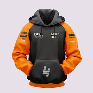 May include: Black and orange hoodie with a large number "4" on the front. The hoodie has several sponsor logos including "DELL Technologies", "CNBC", "SmartSheet", "DWALT", "Webex", and "LAY4".
