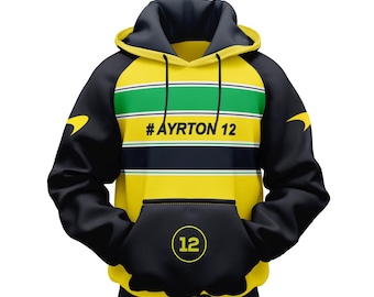 Puede incluir: Sudadera con capucha negra y amarilla con una franja verde y el texto '#AYRTON 12' en la parte delantera. La sudadera tiene un bolsillo canguro negro con un círculo blanco que contiene el número '12' en la parte delantera.