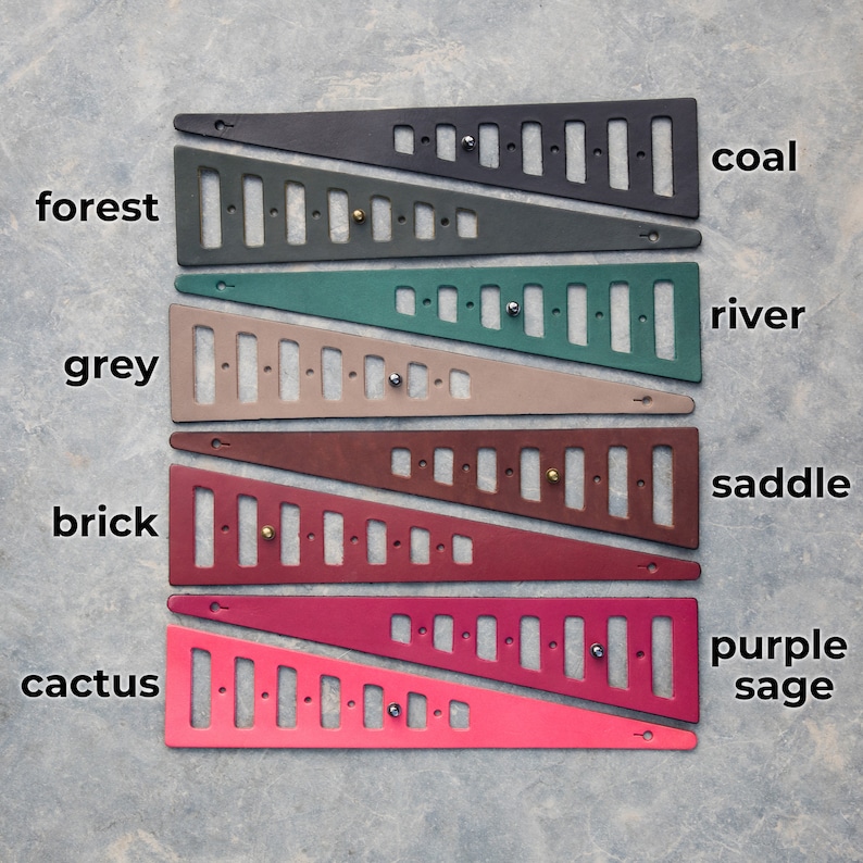 May include: Six leather strips with different colors and names: forest, grey, brick, cactus, coal, river, saddle, purple sage. Each strip has a series of holes and a hook at the end.