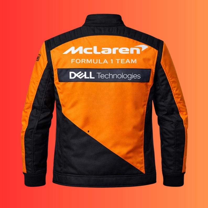 May include: Orange and black McLaren Formula 1 Team jacket. The jacket features the McLaren logo and the Dell Technologies logo. The jacket has a stand-up collar and a quilted design on the sleeves.