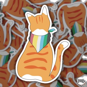 May include: Orange tabby cat sticker with a white outline, wearing a colorful bandana. The cat is sitting with its back to the viewer. The sticker has a white background and is surrounded by other similar stickers. The sticker has a logo in the bottom right corner.