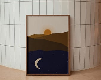 May include: A framed print with a minimalist design featuring a stylized sun setting behind a mountain range and a crescent moon rising over a dark blue sky with stars.