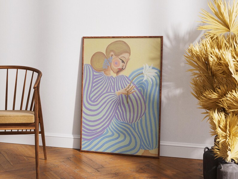 Modern abstract portrait of a woman in a flowing lavender and mint striped dress, holding a white flower. Set against a pastel yellow and blue background, this digital art print features fashion-inspired, feminine energy with bold lines and soft colors. Horizontal layout, perfect for contemporary, editorial-style, and artistic interior decor