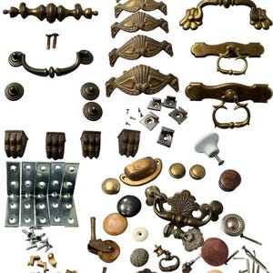 May include: A collection of antique cabinet hardware, including drawer pulls, knobs, handles, and hinges in various styles and finishes. The hardware is primarily brass and bronze, with some wooden and ceramic accents. Includes screws and other mounting hardware.