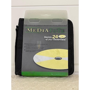 May include: Black MediaTote CD/DVD storage case. The case holds 24 CDs and features a clear plastic top. The front of the case has the words "MEDIATOTE" and "Holds 24 of your Favorites!" printed on it.
