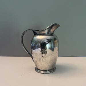 antique silver reed and Barton pitcher