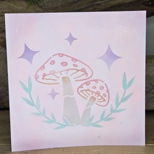 Carte de voeux champignon vénéneux avec breloque marque-page
