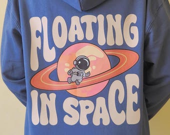 Floating Astronaut Hoodie: Space Lover Clothing