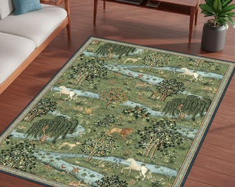 May include: A rectangular area rug with a detailed pastoral scene. The rug features a green and blue color palette with depictions of trees, animals, and a flowing river. The border is a dark blue with a decorative pattern.