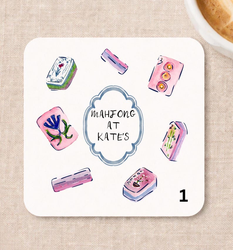 May include: A square coaster featuring a watercolor illustration of various Mahjong tiles in pink, green, and blue hues surrounding a central scalloped frame. The text inside the frame reads Mahjong at Kate's. The number 1 is printed in black.