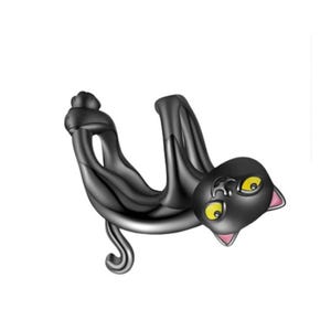 May include: A black cat-shaped charm with yellow eyes and pink inner ears. The charm is stylized and appears to be hanging upside down. The cat's tail curls, and the charm has a glossy finish.