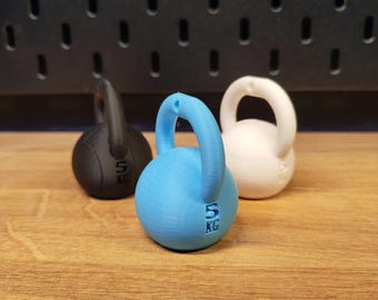 Kettlebell Sleutelhanger & Telefoonhouder – Fitness Cadeau voor Sportliefhebbers – Uniek Gym Accessoire voor Hem of Haar