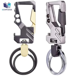 May include: Two metal keychains with carabiner clips. One is dark gray and gold, the other is silver and gray. Both have key rings and bottle opener features. The keychains are designed for durability and functionality.