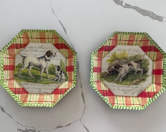 May include: Two octagonal decorative plates with a red and yellow plaid pattern and a green border. Each plate features a vintage illustration of dogs in a field, with handwritten script around the image.