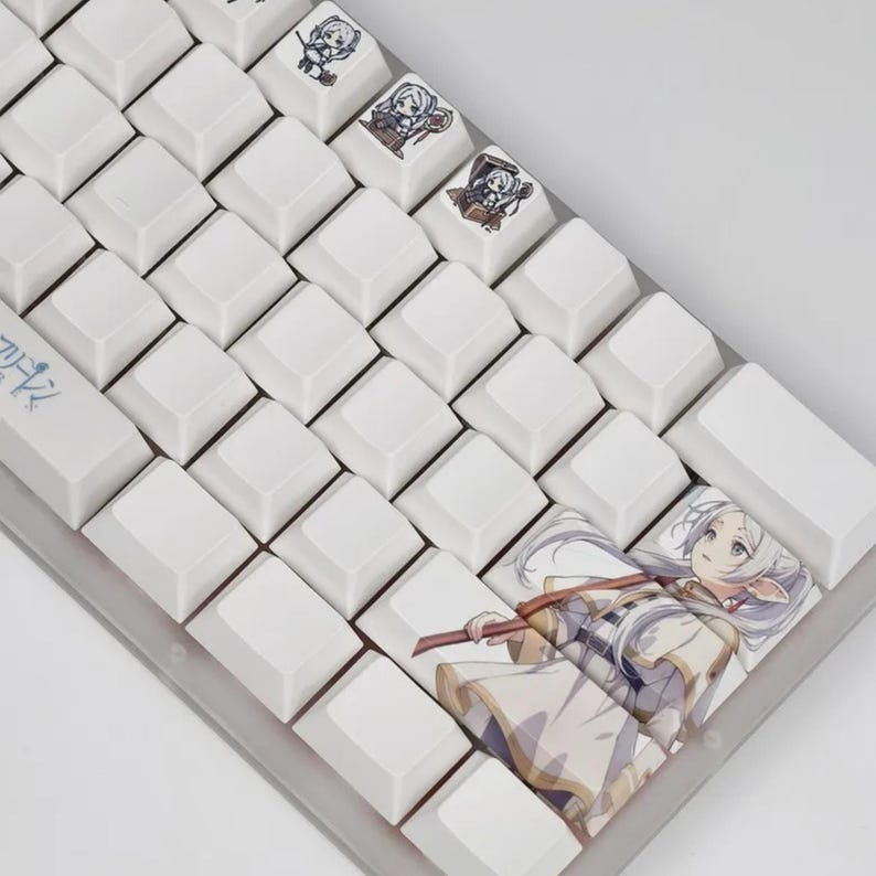 May include: A white mechanical keyboard with custom keycaps featuring anime-style illustrations. The keycaps have various anime character designs. The keyboard has a gray frame and white keycaps. The keycaps are square and evenly spaced.