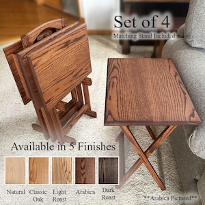 May include: Set of four wooden TV tray tables in the Arabica finish, with a matching stand. The tables are made of wood and have a folding design. The image also shows the available finishes: Natural, Classic Oak, Light Roast, and Dark Roast.