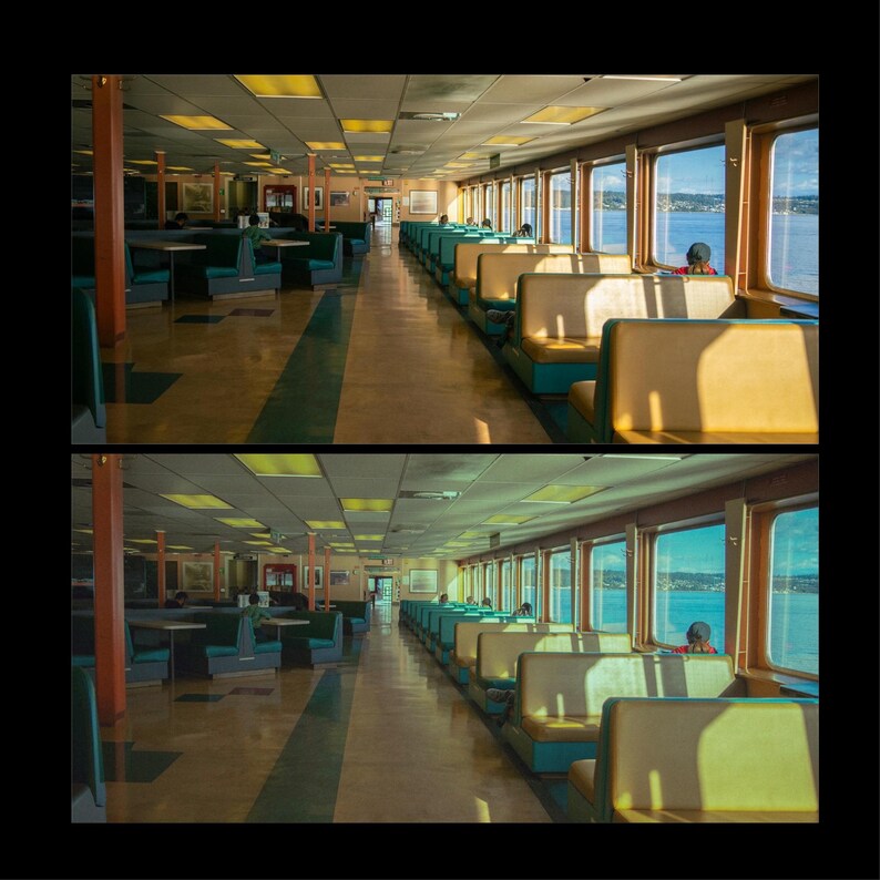 May include: An empty ferry boat interior with rows of teal blue seats facing large windows with views of the water. The seats are arranged in a staggered pattern and the windows are lined with white trim.