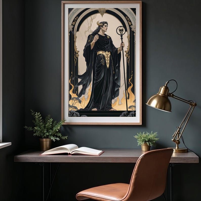 May include: Framed art print featuring a figure in black robes with gold accents, holding a staff topped with a skull. The artwork has a gothic theme, set against a beige background with gold flames and a dark frame. The print is displayed on a dark wall.