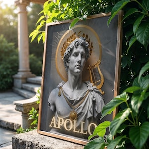 May include: A framed print of a bust of Apollo, the Greek god of music, poetry, prophecy, healing, and the sun. The bust is made of white marble and is set against a grey background. The print is framed in a wooden frame with a gold finish. The print includes the word "APOLLO" in gold lettering.