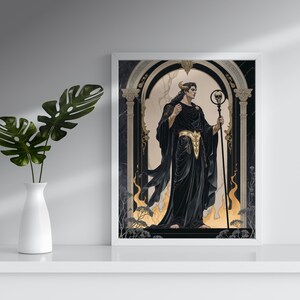 May include: A framed art print featuring a figure in black robes with a golden belt, holding a staff with a skull. The artwork has a gothic theme with a dark color palette and decorative archway.