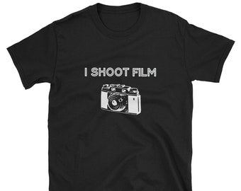 May include: Black t-shirt with white text that reads "I SHOOT FILM" and a vintage camera graphic.