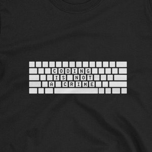 May include: Black t-shirt with a white graphic of a computer keyboard with the text "CODING IS NOT A CRIME" on it.