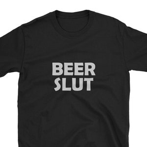 May include: Black t-shirt with the text "BEER SLUT" printed in white.