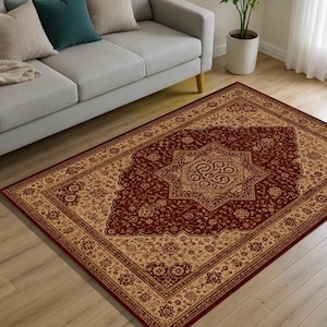 May include: A rectangular area rug featuring a deep red central field with a prominent beige star-shaped medallion and intricate floral patterns. The border is wide and beige, decorated with repeating floral motifs in red and dark brown tones.