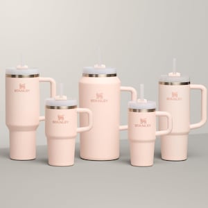 May include: A collection of five pink insulated tumblers and mugs with white lids and straws. Each tumbler features a handle and the "STANLEY" logo. The sizes vary, offering options for different beverage needs.