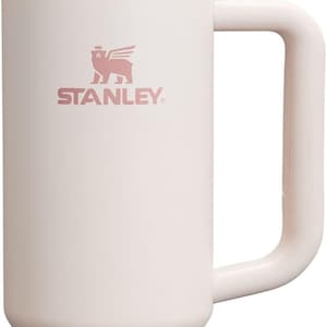May include: A light pink Stanley Quencher H2.0 FlowState stainless steel tumbler with a handle and straw. The Stanley logo is printed on the front. The tumbler is designed to keep drinks cold for hours.