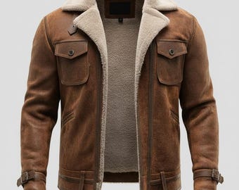 May include: A brown leather jacket with a shearling collar and lining. The jacket features two front pockets, a zip closure, and adjustable straps at the waist and cuffs. The jacket is a classic style.
