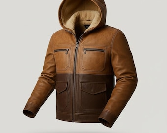 May include: A two-tone brown leather jacket with a hood. The upper section is a lighter brown, while the lower section is a darker brown. The jacket has a zip-up front, two chest pockets, and two lower pockets. The hood is lined with a tan, fuzzy material.