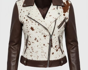 May include: A brown and white cowhide print leather jacket with a classic asymmetrical zip closure. The jacket features brown leather sleeves, collar, and trim, with silver hardware accents. A stylish outerwear piece.