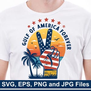May include: A white t-shirt with a vintage-style graphic design featuring a peace sign with an American flag pattern, palm trees, and a sunset. The text "GULF OF AMERICA FOREVER" is written in a circle around the peace sign.