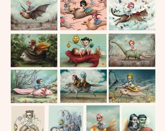 May include: A mini portfolio titled THE RIDERS SERIES BY MAB GRAVES featuring twelve distinct illustrations of characters riding various creatures, including a bat, a cat, a hedgehog, a dinosaur, an axolotl, a snail, and a goldfish.